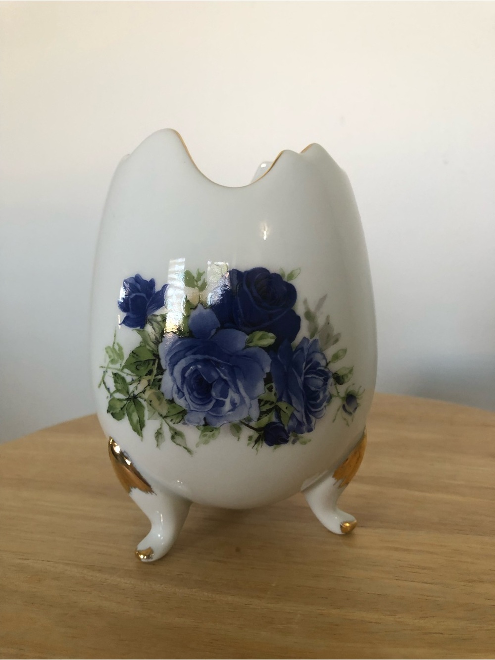 White Porcelain Footed Vase with Blue Rose Design and Gold Accents